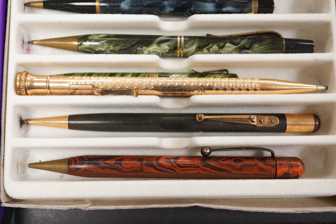 A collection of vintage pencils including an early enamel example
